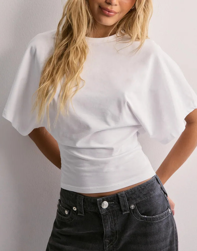 Chic women's wide sleeve top, versatile for office or casual wear. Modern, trendy blouse with oversized sleeves.