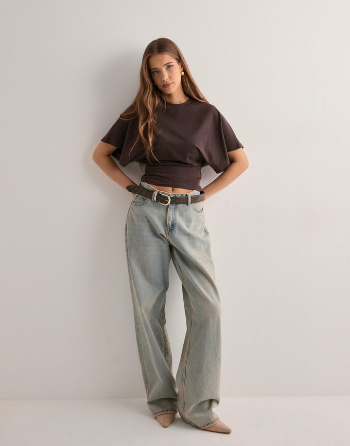 Comfortable women's t-shirt with oversized wide sleeves, offering a relaxed fit for everyday casual wear.