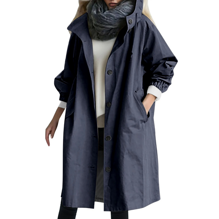Comfortable women's windproof long trench coat with a protective hood. Elegant and versatile outerwear.