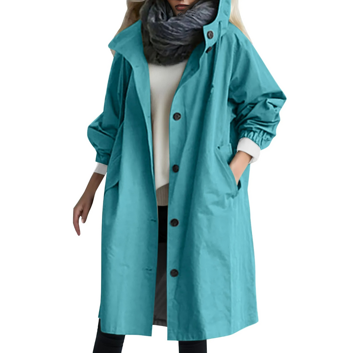 Long, elegant women's hooded trench coat, offering stylish wind protection for spring & fall days.