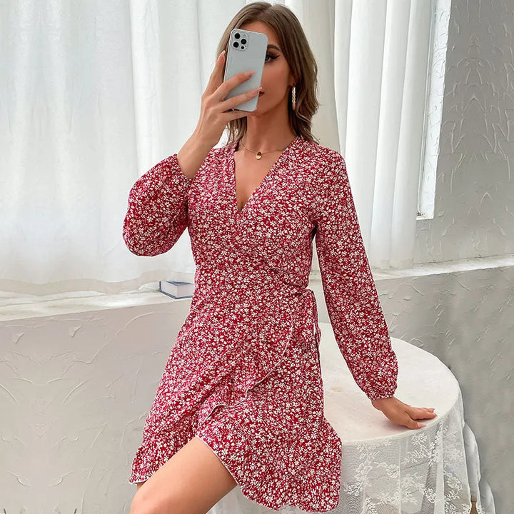 Casual yet elegant women's wine red wrap mini dress with ruffles, V-neck, long sleeves & tie waist for autumn comfort.