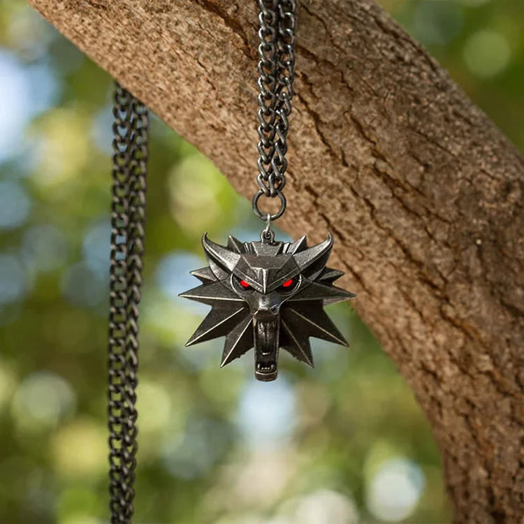 Close-up of a gleaming stainless steel wolf hunt locket necklace, a bold statement animal jewelry for women.