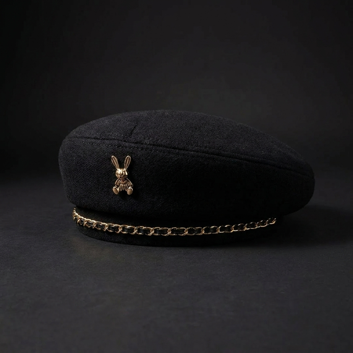 Chic women's baseball cap featuring a detailed gold bee emblem and chain accent, perfect as a statement piece.