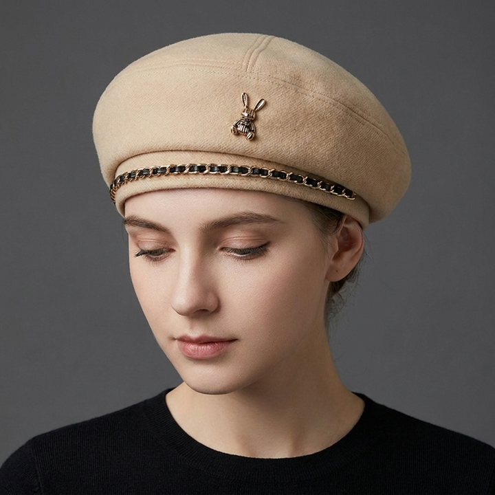 Fashion accessory: Women's baseball cap, chic wool blend, featuring an ornate sculptural gold bee and chain.