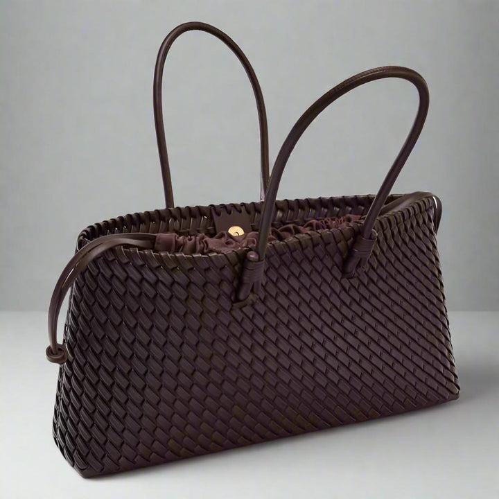 Close-up: Women's woven leather handbag, showcasing unique textured leather design.