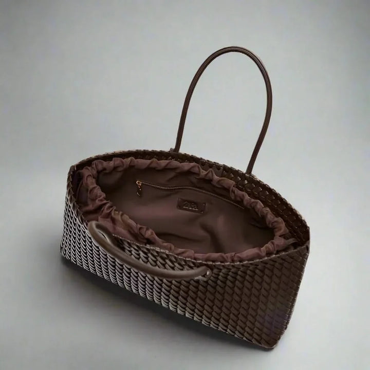 Elegant women's woven leather handbag with rich texture. Ideal for daily use & chic outfits.