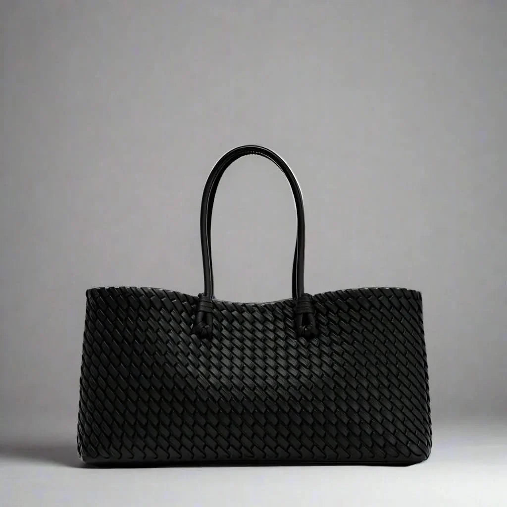 Chic women's woven leather handbag. Sophisticated everyday shoulder bag & fashion accessory.