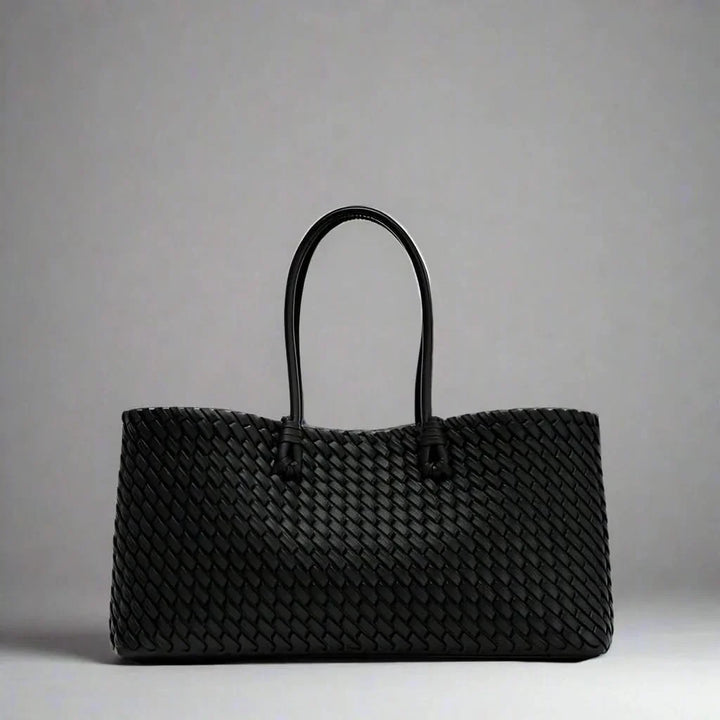 Chic women's woven leather handbag. Sophisticated everyday shoulder bag & fashion accessory.