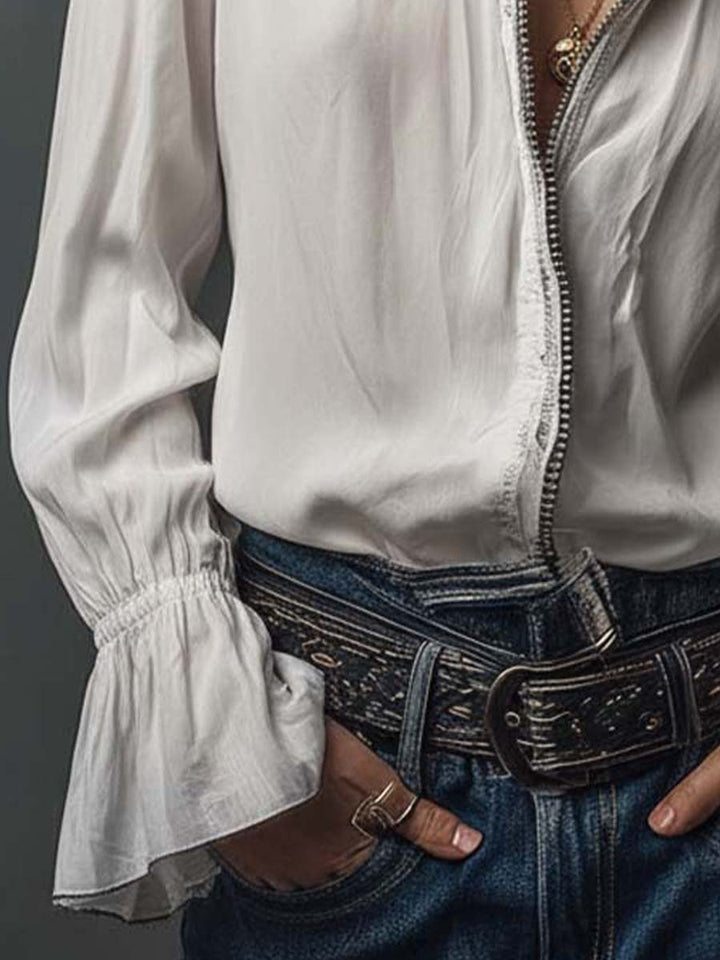 Versatile women's blouse with a sleek zip front and stylish bell cuffs. Ideal for office or everyday.