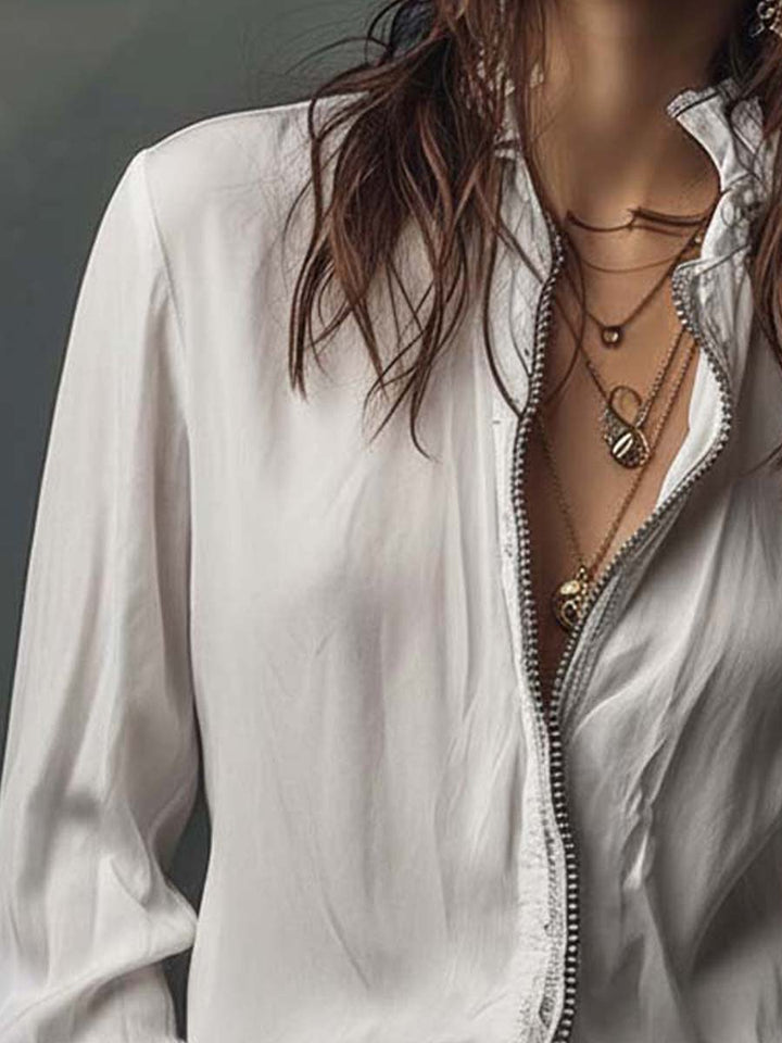Sophisticated women's zip-front shirt, long sleeve, with trendy bell cuffs for a tailored look.