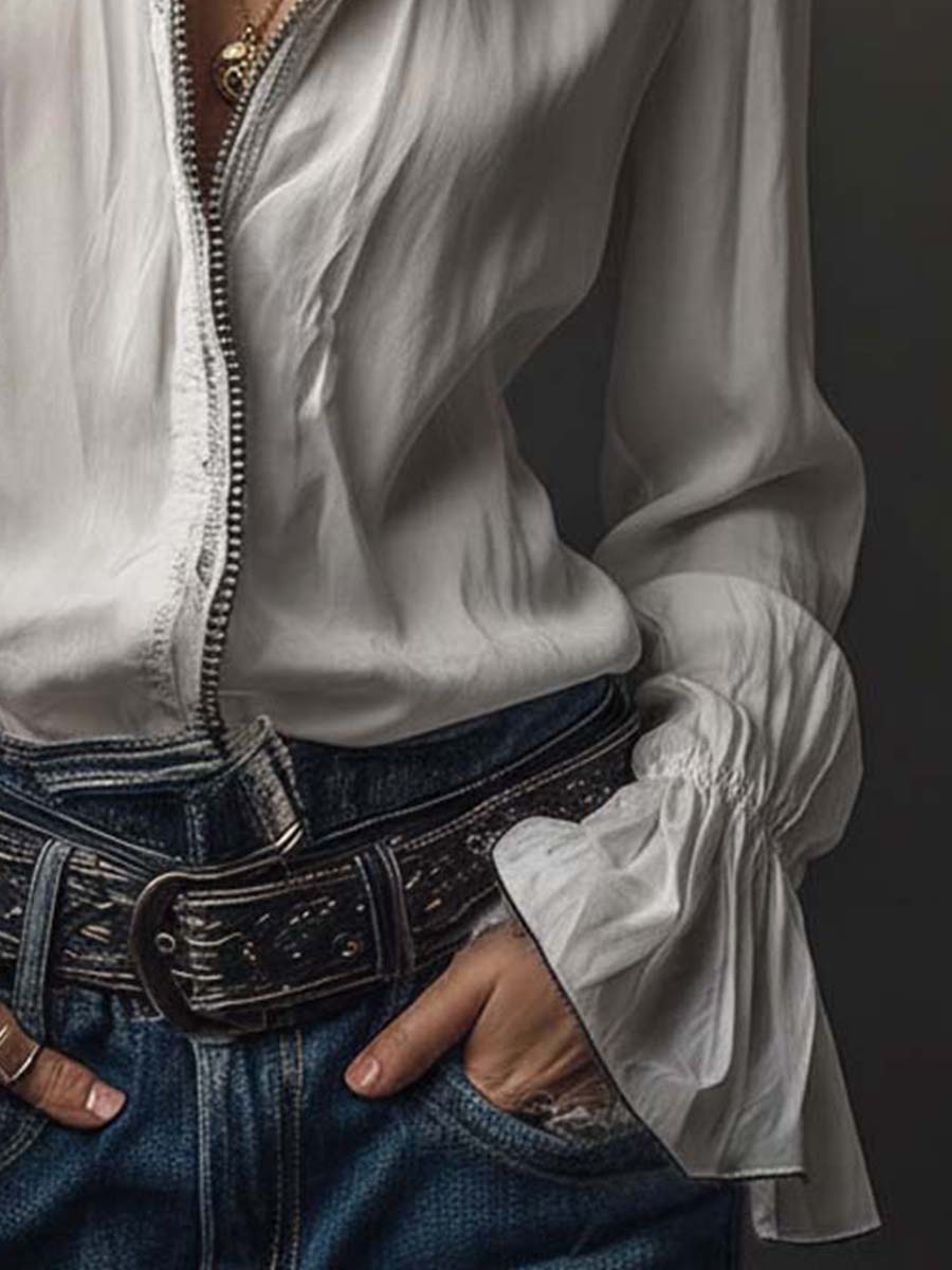 Modern women's blouse: zip front, long sleeves, and distinctive bell cuffs. Perfect for work or leisure.