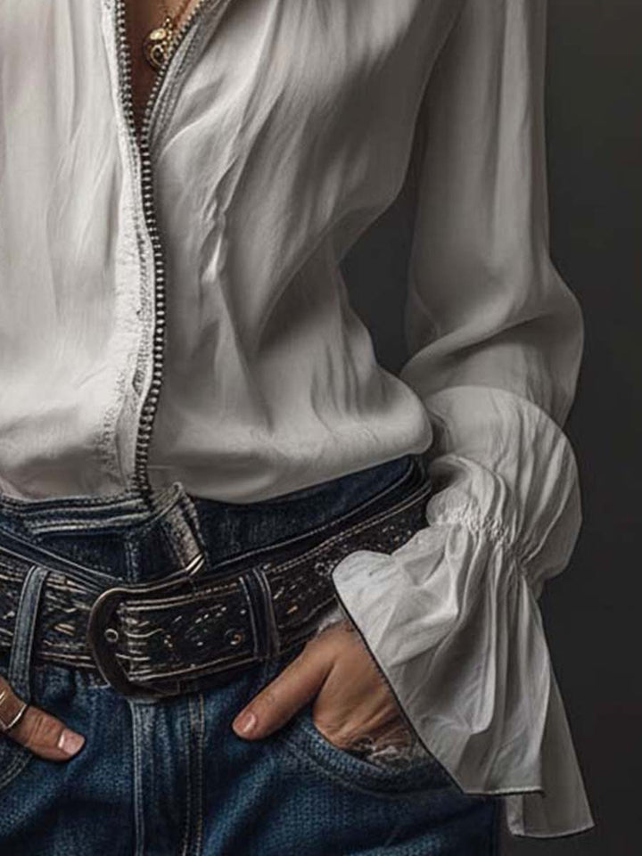 Modern women's blouse: zip front, long sleeves, and distinctive bell cuffs. Perfect for work or leisure.