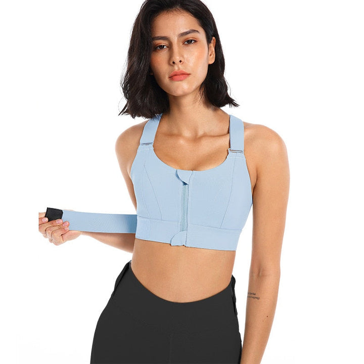 Stylish women's athletic sports bra, zip front, offering comfort & back support for training.