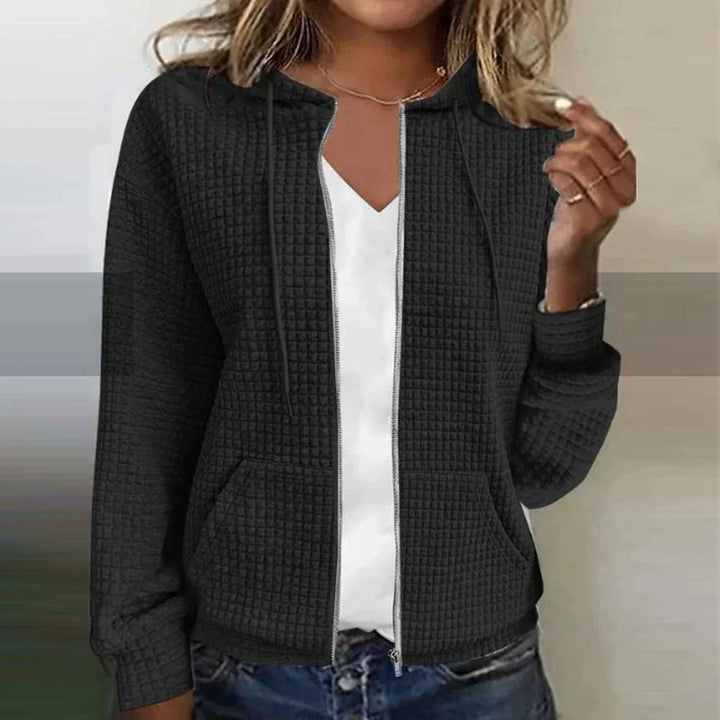 Fashionable women's waffle knit comfort jacket, a casual zip-up outerwear piece for cozy everyday looks.