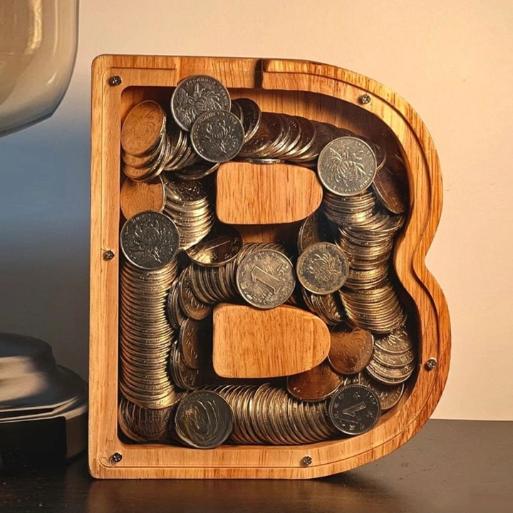 Wooden alphabet letter money bank for children's savings, great for nursery decor.