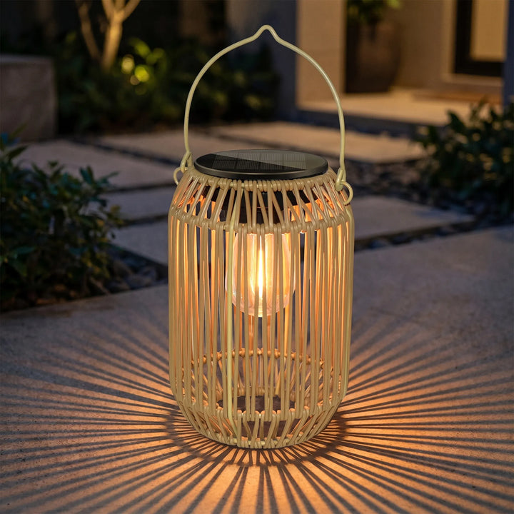 Woven solar outdoor lantern for garden & patio. Weatherproof bamboo-style ambient light, cordless decor.