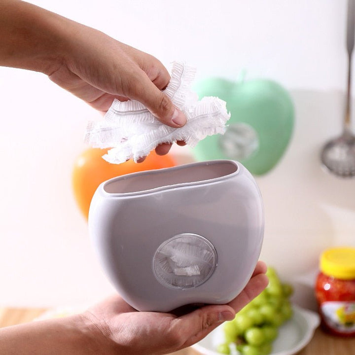 Efficient kitchen organization with WrapEase tear-resistant food wrap and dispenser, perfect for fresh food & leftovers.