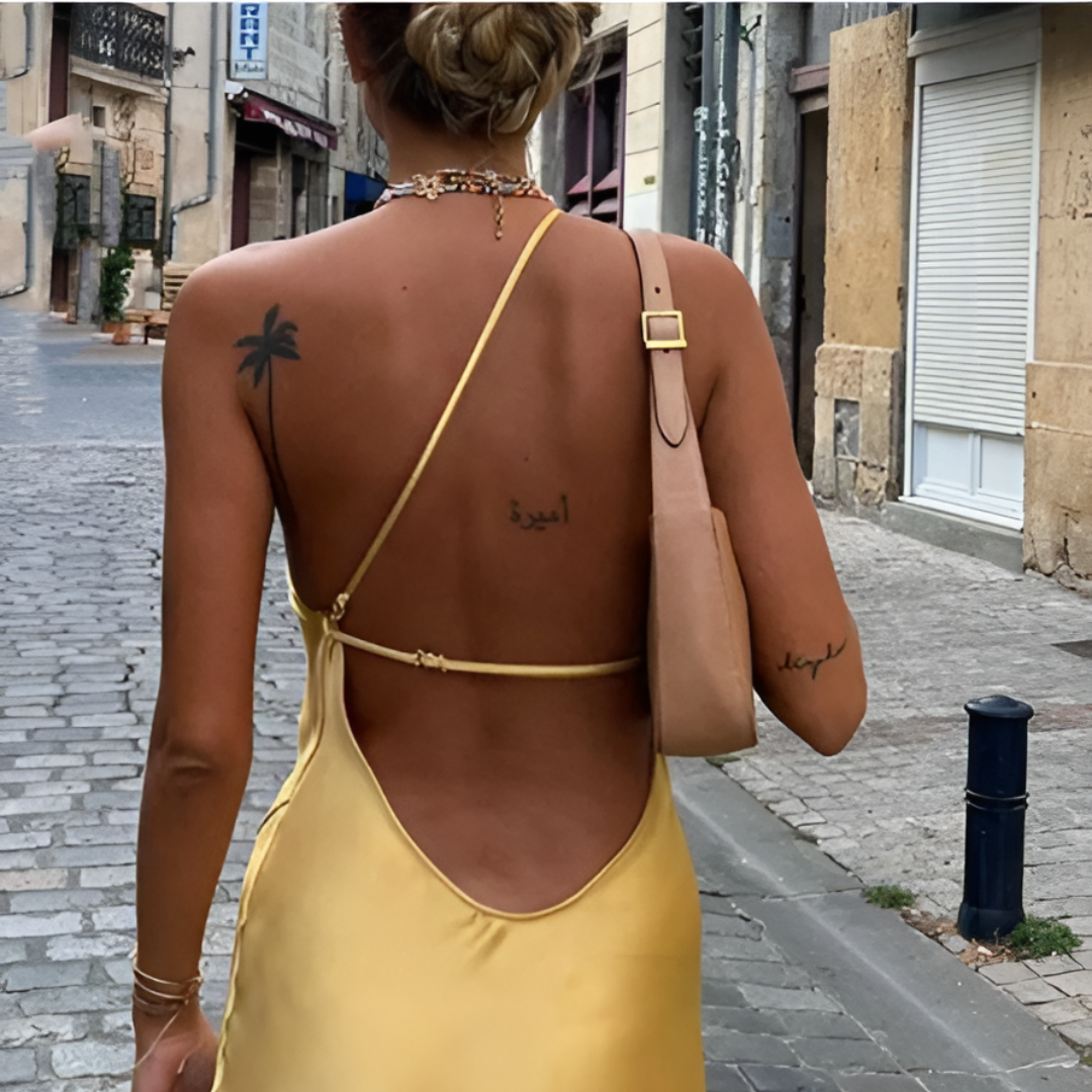 Feminine yellow sundress with an open back and off-shoulder design, ideal for beach, vacation, or summer parties.