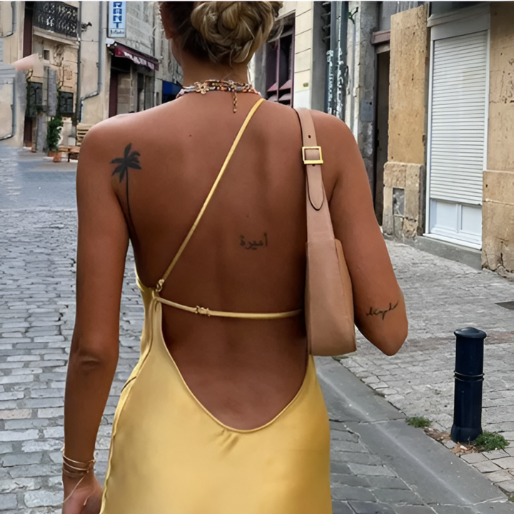 Feminine yellow sundress with an open back and off-shoulder design, ideal for beach, vacation, or summer parties.