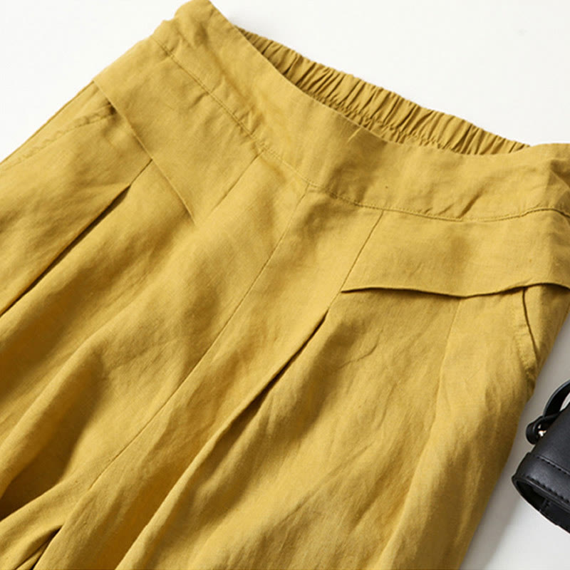 Beige women's wide-leg pants with a relaxed fit, perfect for comfortable casual wear.