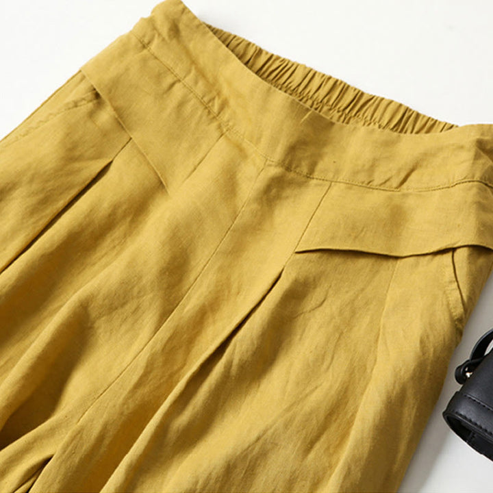 Beige women's wide-leg pants with a relaxed fit, perfect for comfortable casual wear.