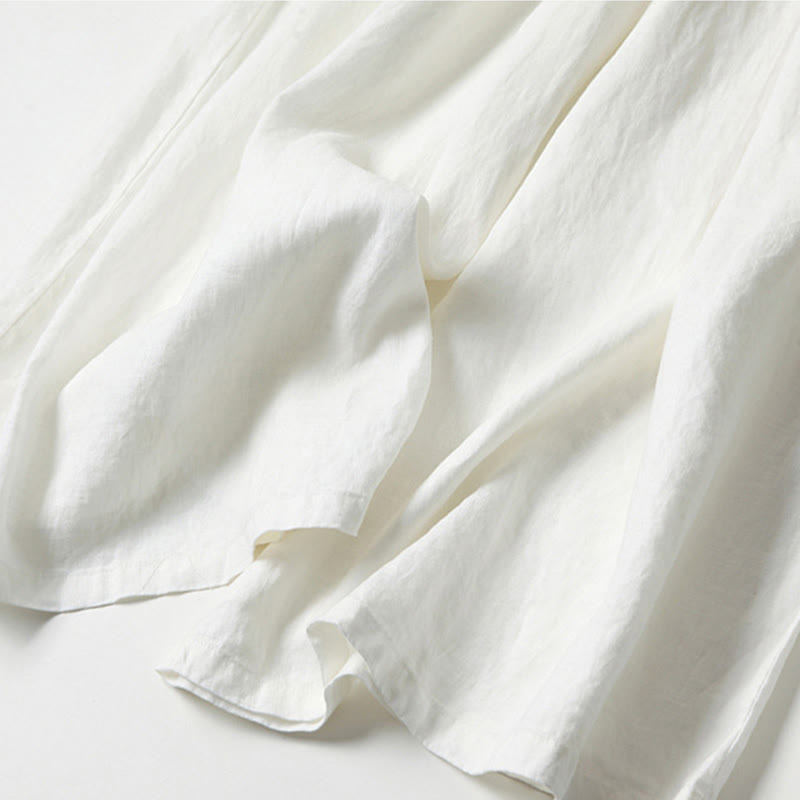 White women's high-waisted wide-leg trousers, relaxed fit for comfortable & chic everyday fashion.