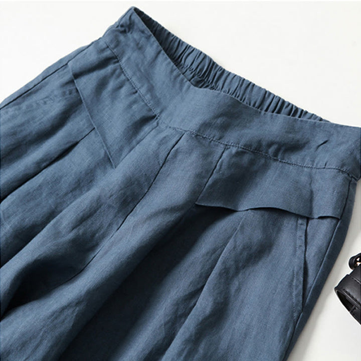 Versatile beige relaxed fit wide-leg trousers, high-waisted for women's effortless style.