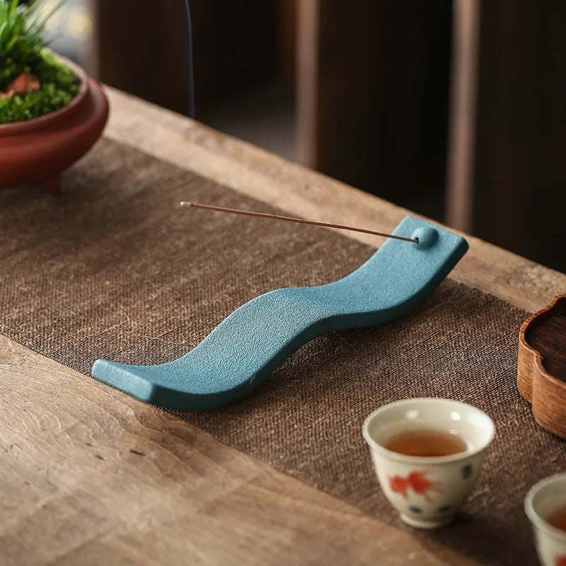Premium ceramic Zen Wave incense holder for fragrance. Adds a touch of zen to home decor and relaxation.