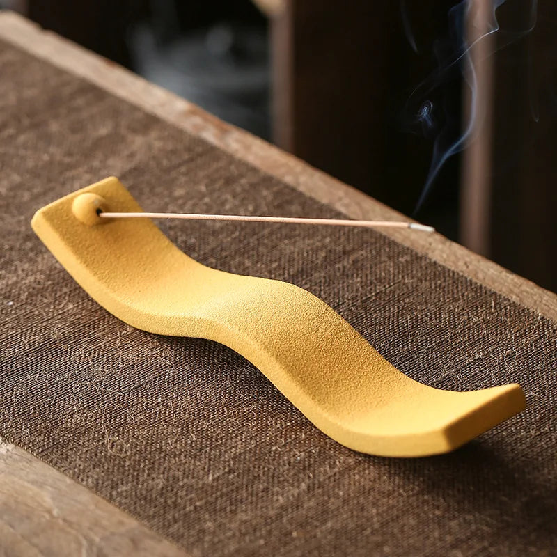 Contemporary ceramic wave design incense holder. Ideal for modern home decor, relaxation, and aromatherapy.