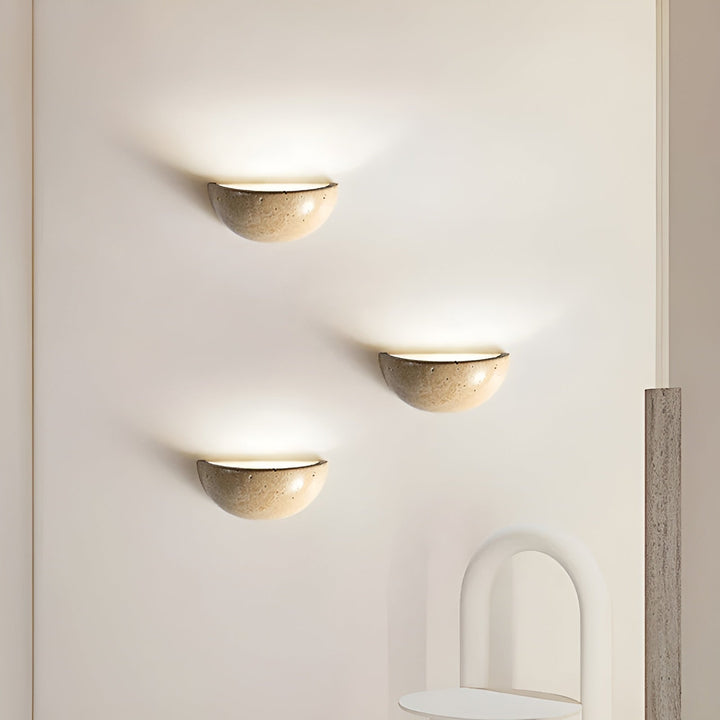 Elegant wabi-sabi LED half-round wall lamp. Zen-inspired sconce for modern interior design and soft lighting.