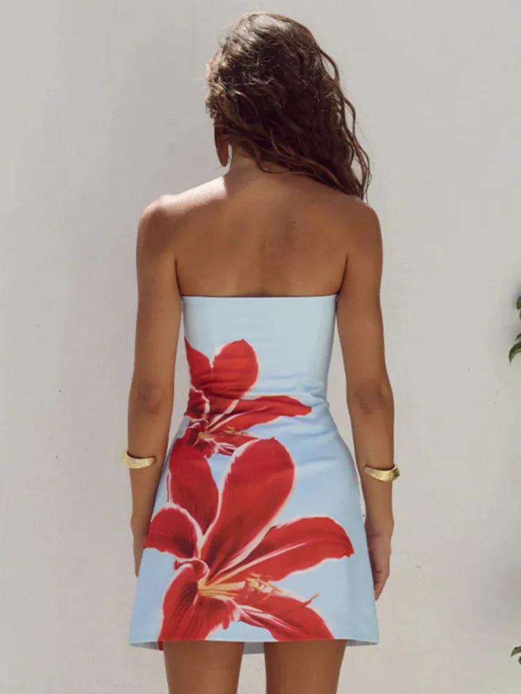 Close-up of the floral pattern on a women's summer mini dress with adjustable straps